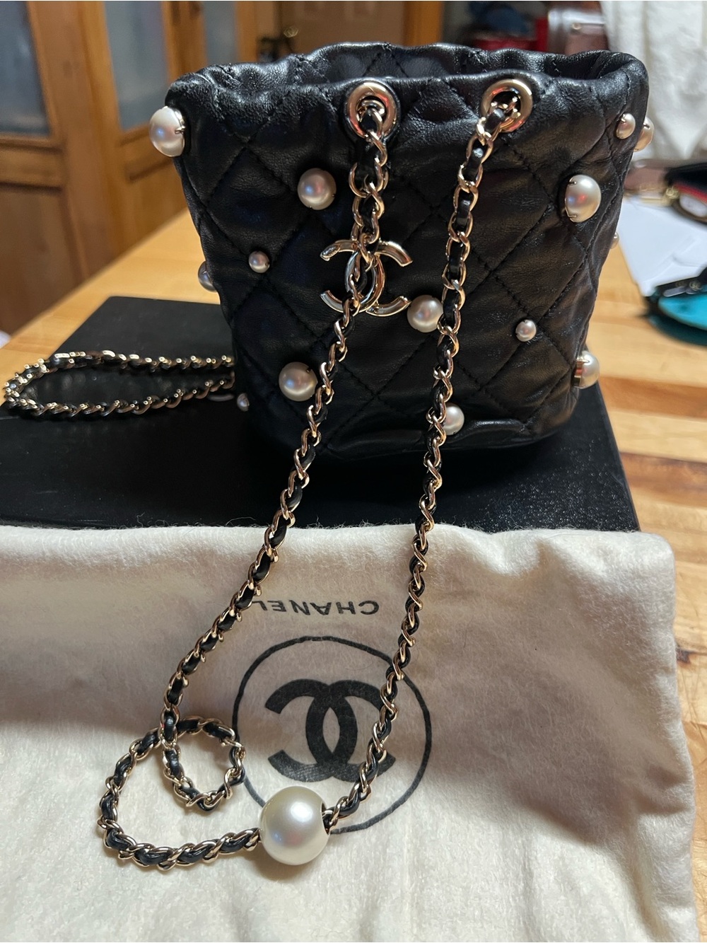 CHANEL About Pearls Black Quilted Pearl-Embellished Mini Lambskin Bucket Bag